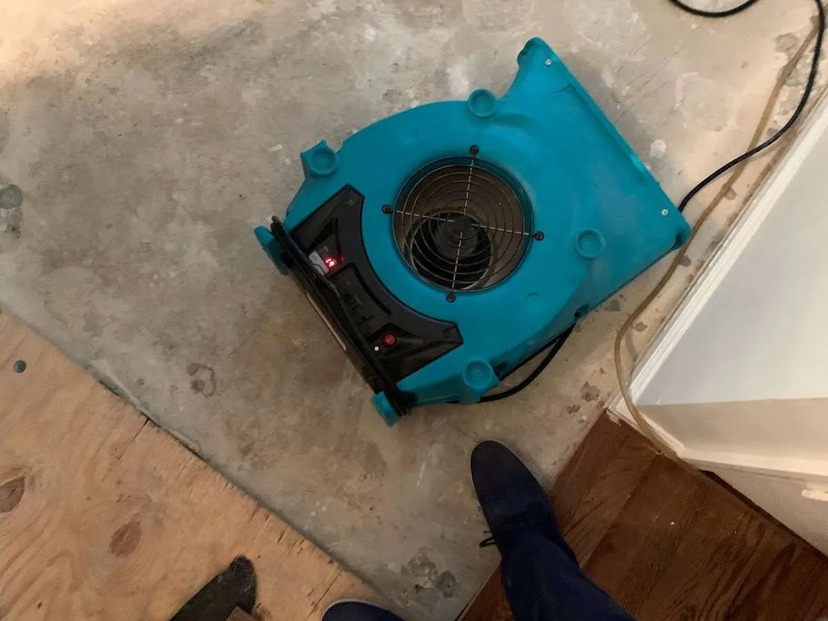 Air mover drying subfloor during Leak Detection & Repair in Damascus
